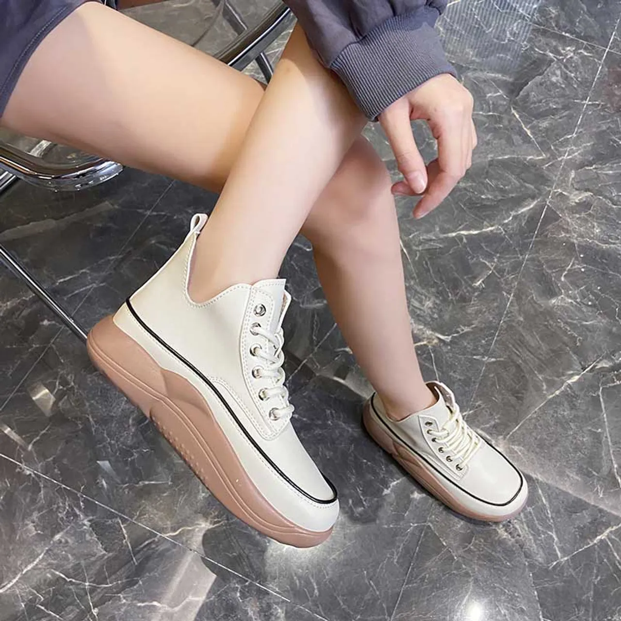 White stitch accents rocker bottom shoe sneaker