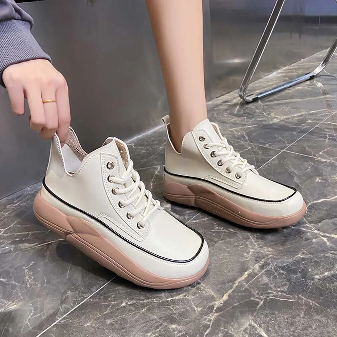 White stitch accents rocker bottom shoe sneaker