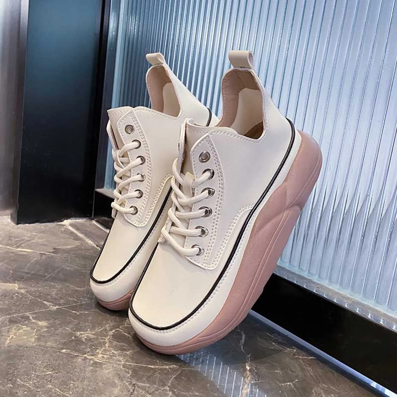 White stitch accents rocker bottom shoe sneaker